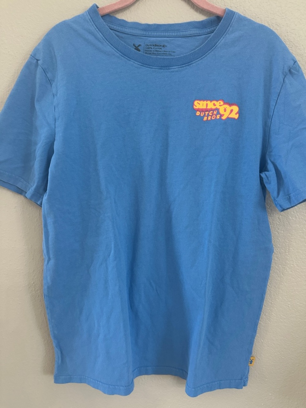 Dutch Bros Light Blue Tee with Orange & Yellow Logo